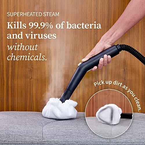 Hand using steam cleaner on fabric to kill bacteria and viruses without chemicals.